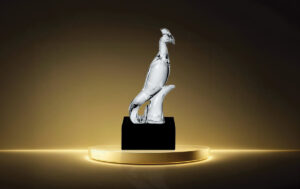 A photograph of The Phoenix Award, a glass statue shaped like a phoenix.